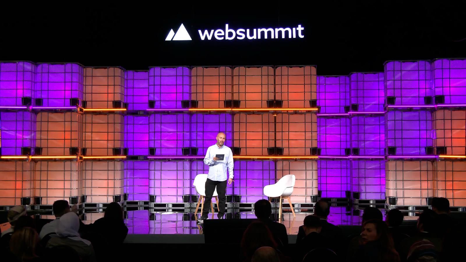 Dan Feldstein speaking on stage at Web Summit